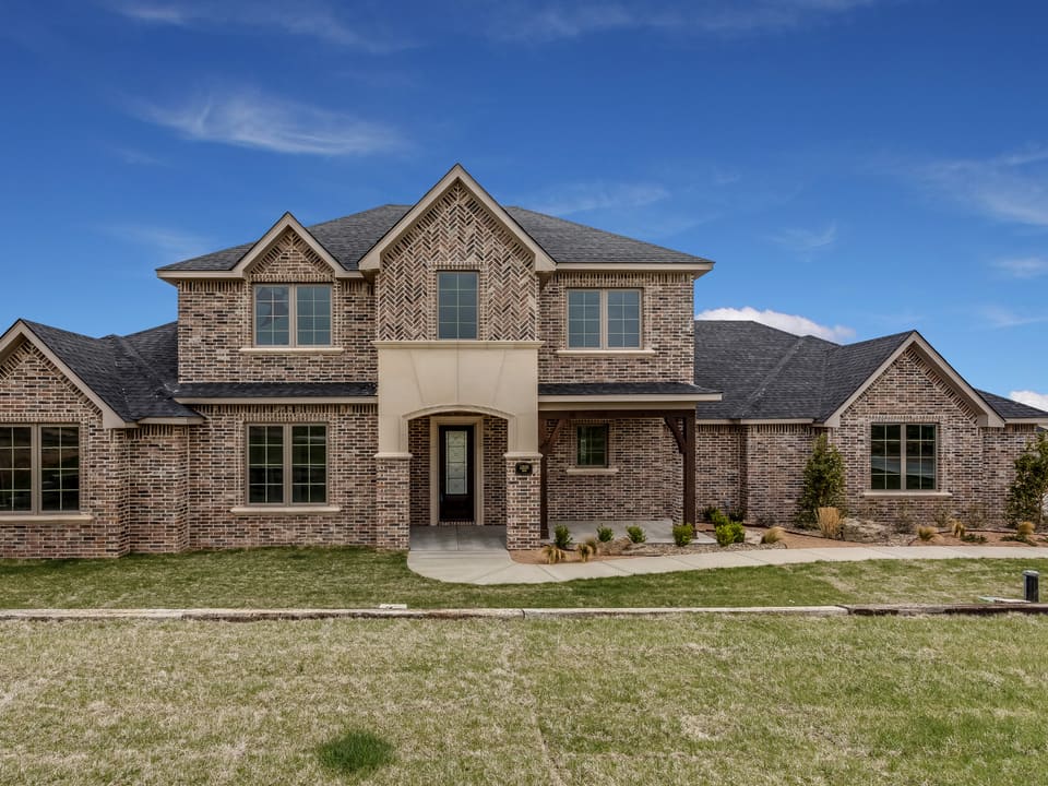 A newly built brick home in a North Texas new-construction community.